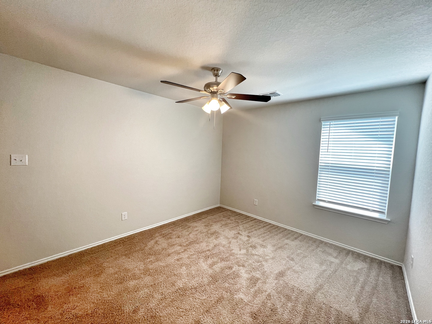 29529 Spring Copper Bulverde, TX 78163 - Photo 29 of 41 an empty room with a window and a fan