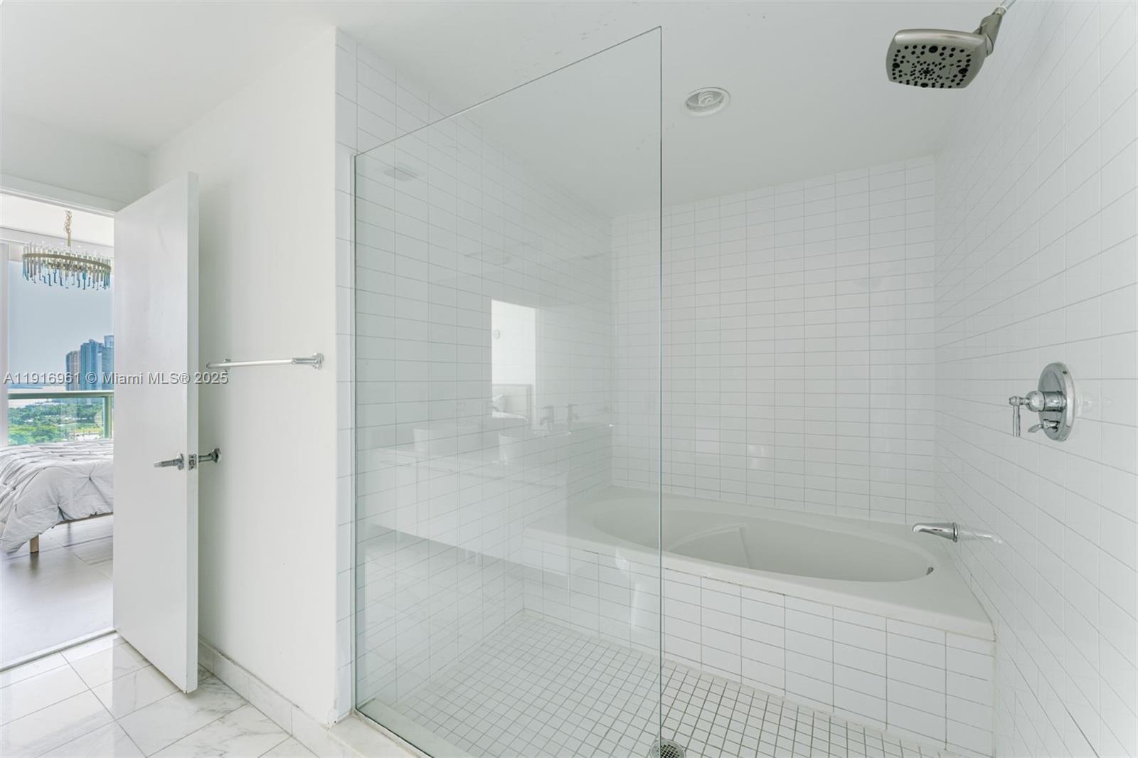 888 Biscayne Boulevard, Unit 1704 Miami, FL 33132 - Photo 13 of 20 a bathroom with a shower
