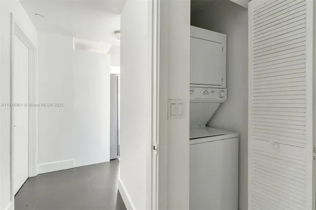 a view of a hallway with a refrigerator