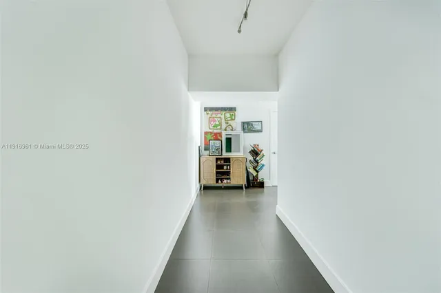 a view of a hallway with a closet