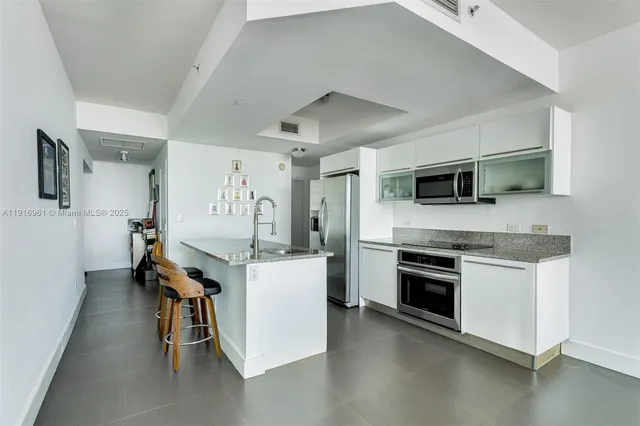 a view of kitchen with furniture and wooden floor