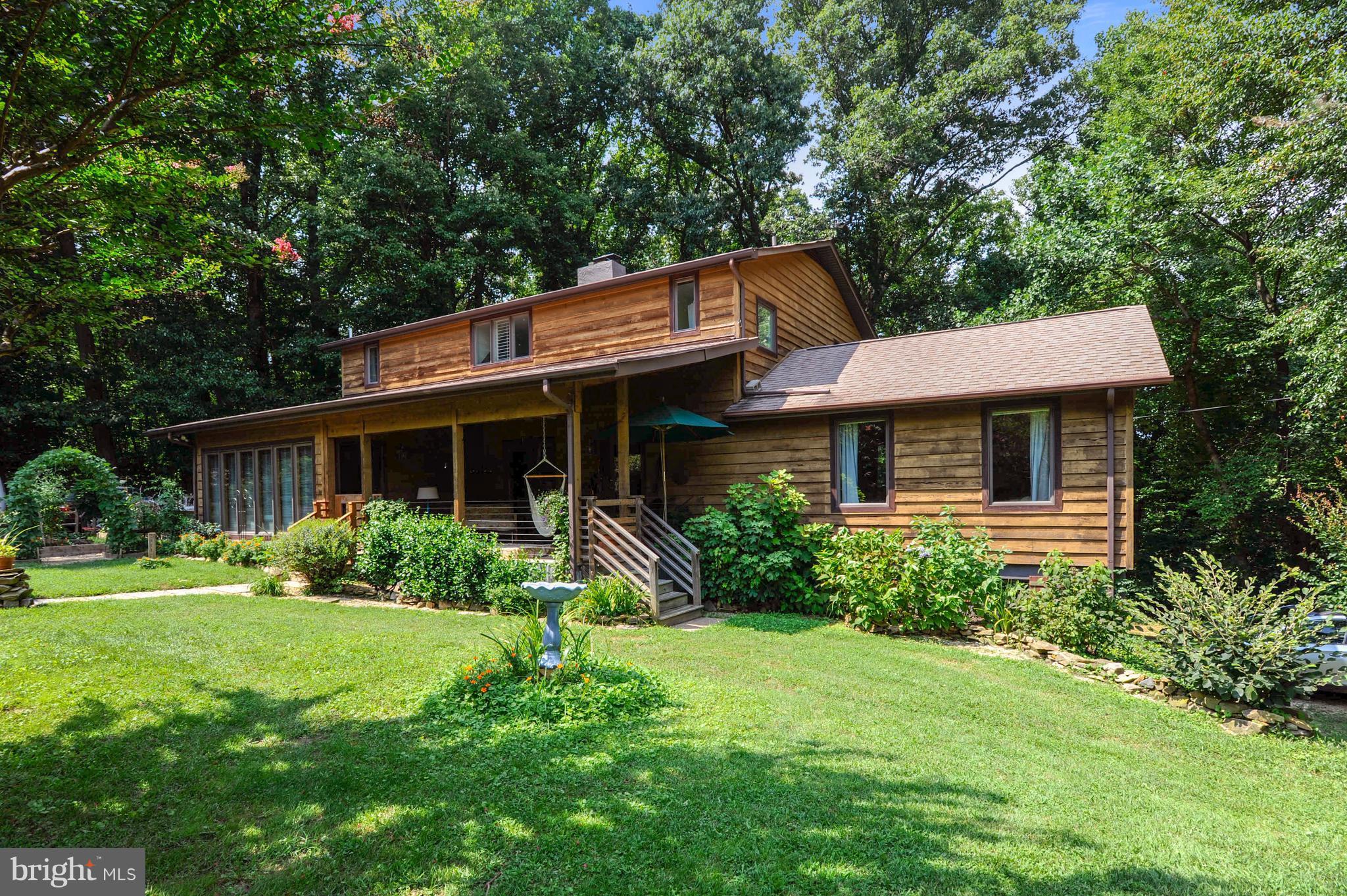 401 Farmington Road West Accokeek, MD 20607 - Photo 1 of 30 a front view of a house with a yard