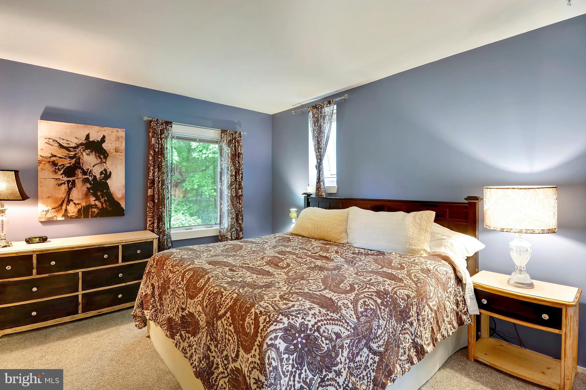 401 Farmington Road West Accokeek, MD 20607 - Photo 15 of 30 a bedroom with a bed and a window