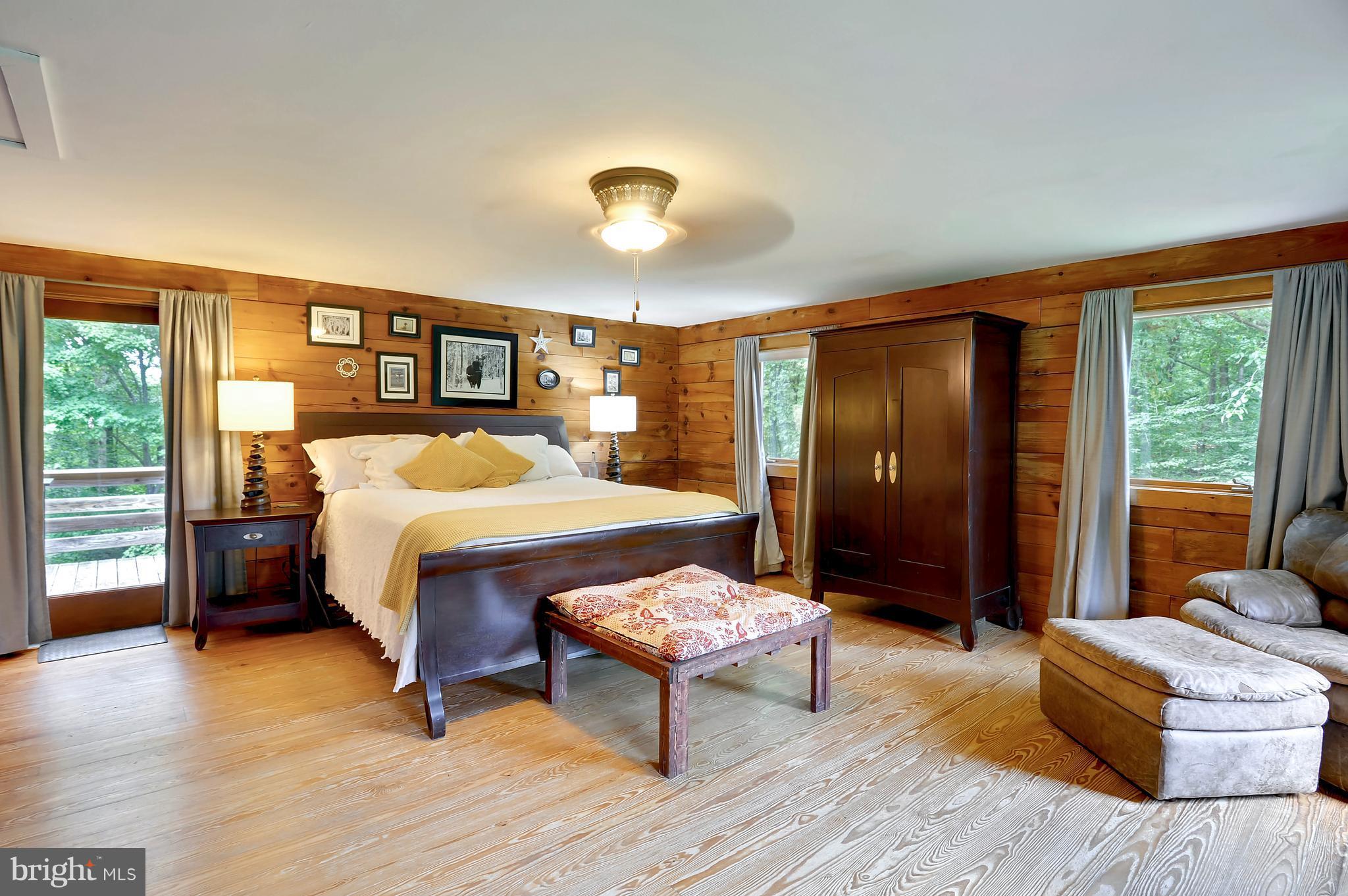401 Farmington Road West Accokeek, MD 20607 - Photo 10 of 30 a bedroom with a bed and wooden floor