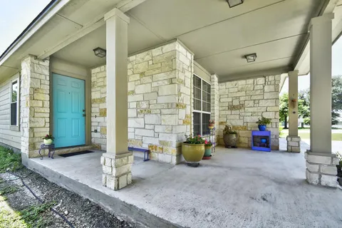 a view of an outdoor space with porch and patio