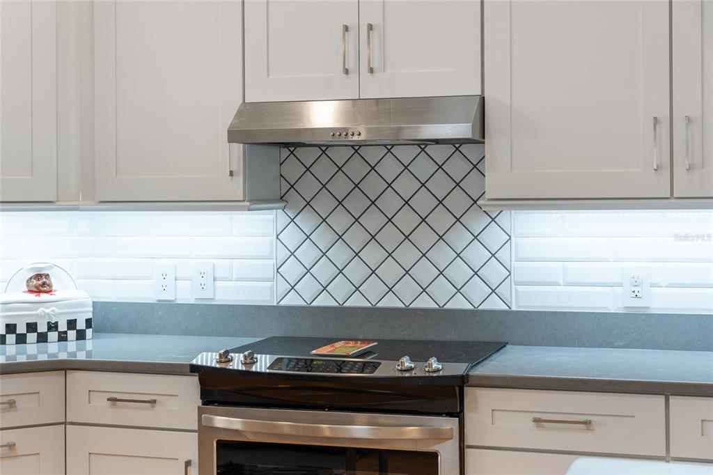 1348 Honea Path The Villages, FL 32162 - Photo 20 of 82 a stove top oven sitting inside of a kitchen