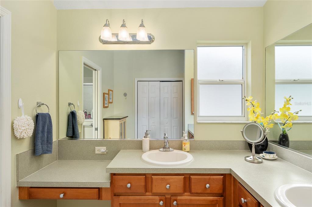 1348 Honea Path The Villages, FL 32162 - Photo 48 of 82 a bathroom with a granite countertop sink and a mirror