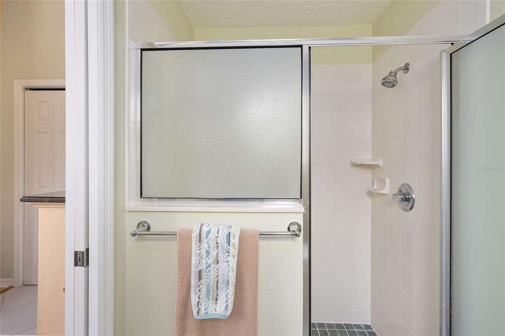 1348 Honea Path The Villages, FL 32162 - Photo 50 of 82 a bathroom with a shower and a mirror
