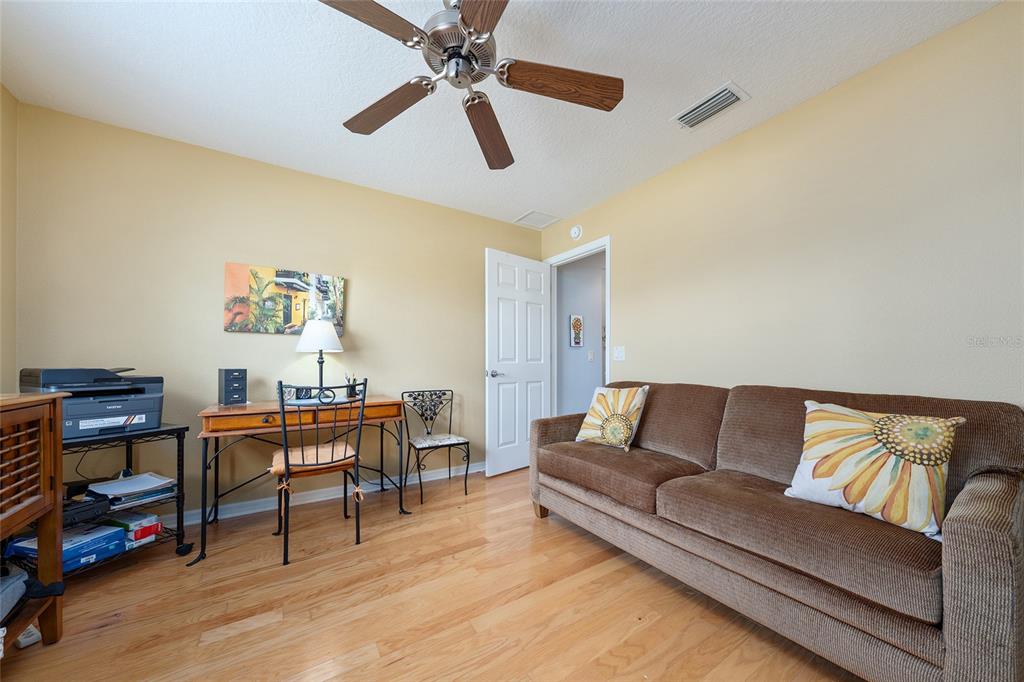 1348 Honea Path The Villages, FL 32162 - Photo 51 of 82 a living room with furniture and a wooden floor