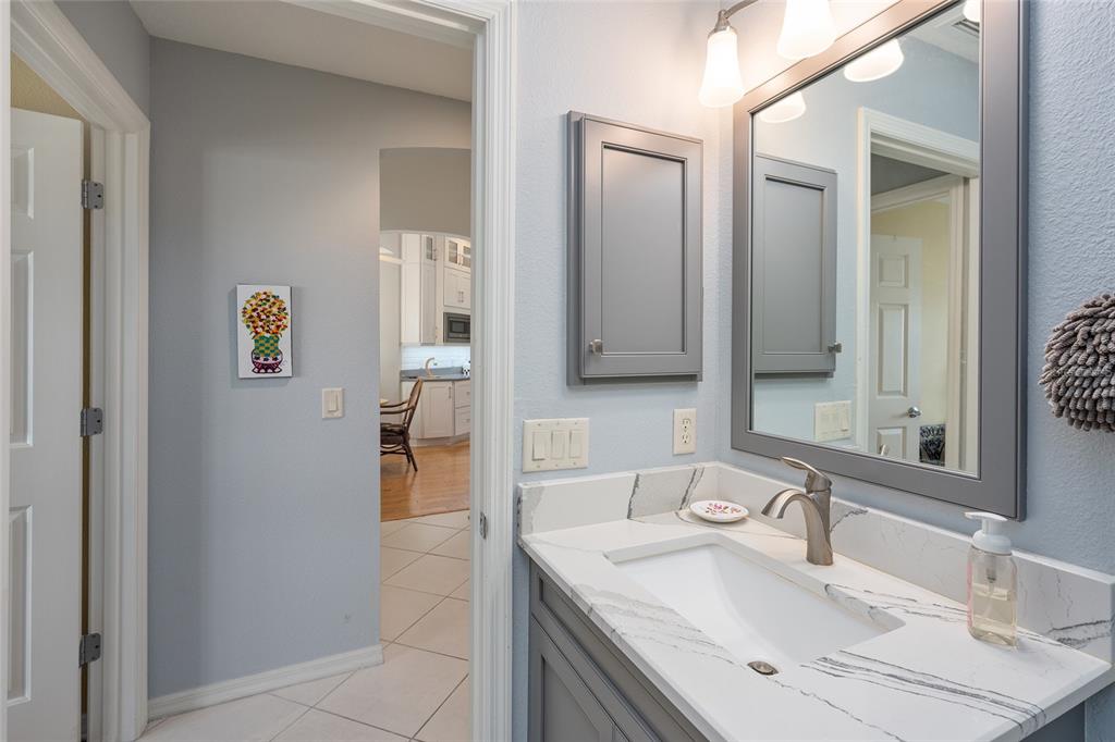 1348 Honea Path The Villages, FL 32162 - Photo 54 of 82 a bathroom with a sink and a mirror