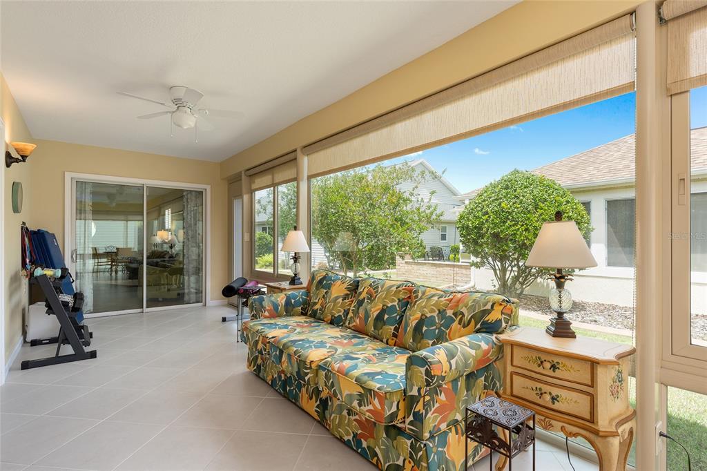1348 Honea Path The Villages, FL 32162 - Photo 63 of 82 a living room with furniture and a large window