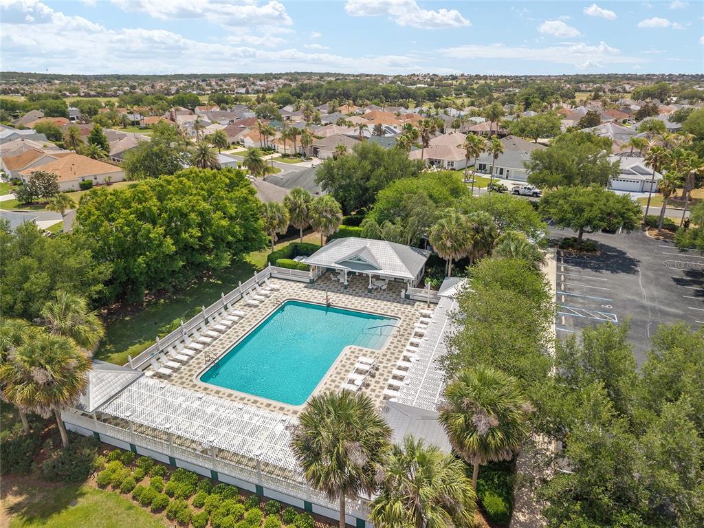 1348 Honea Path The Villages, FL 32162 - Photo 79 of 82 an aerial view of a house with a garden and lake view