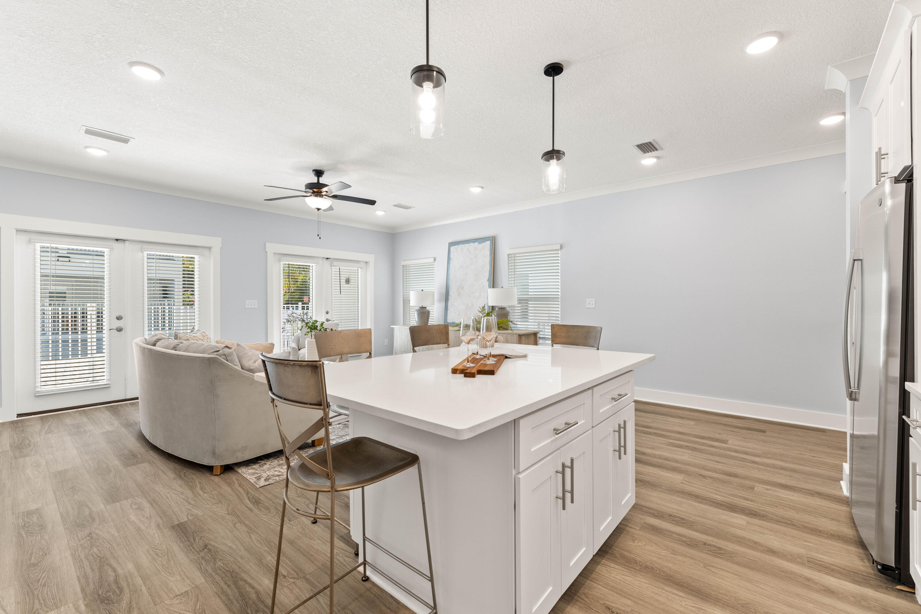 100 Beach Drive, Unit 7 Destin, FL 32541 - Photo 13 of 33 a view of kitchen island with sink and refrigerator