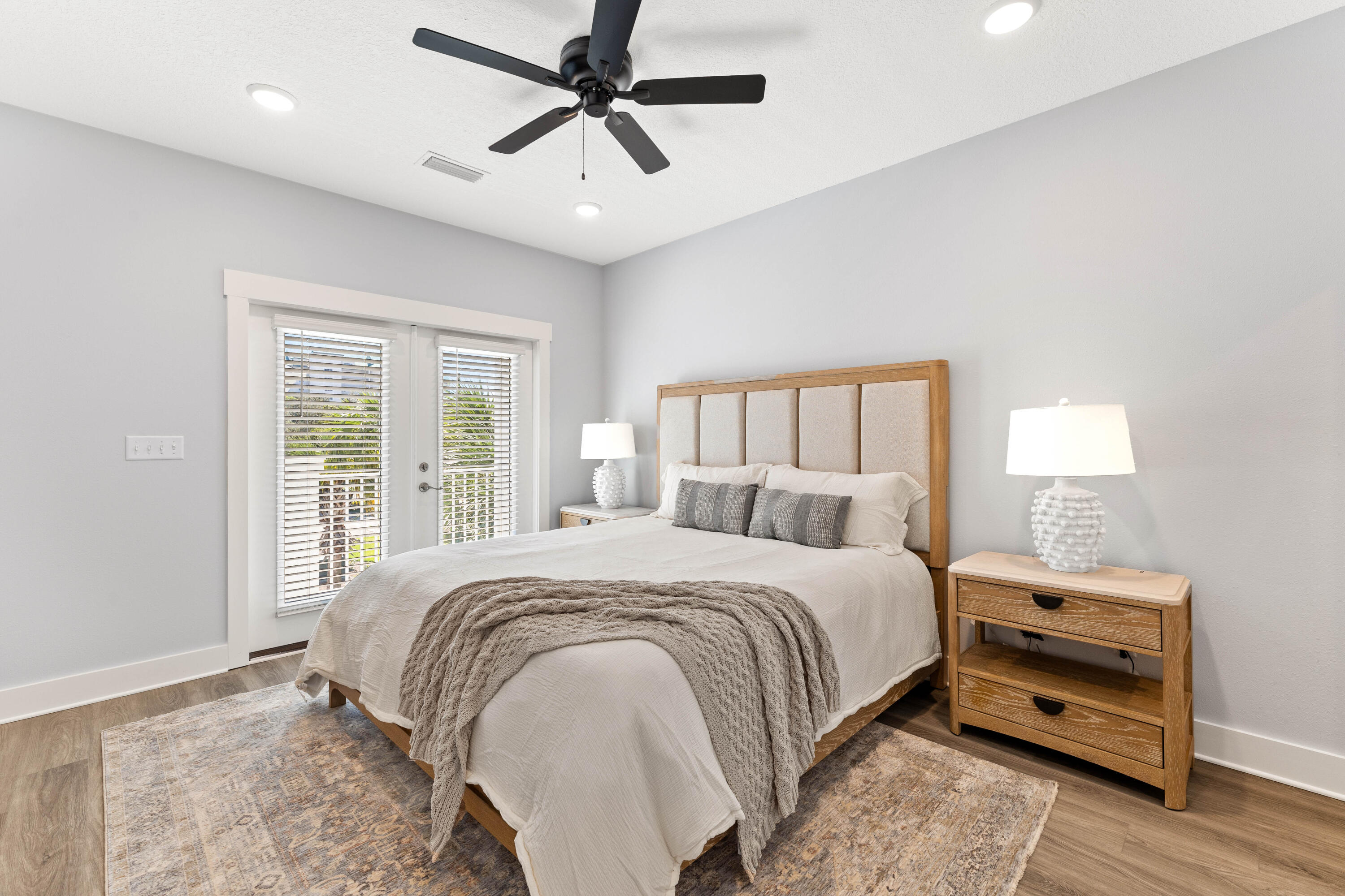 100 Beach Drive, Unit 7 Destin, FL 32541 - Photo 22 of 33 a bedroom with a large bed and a window