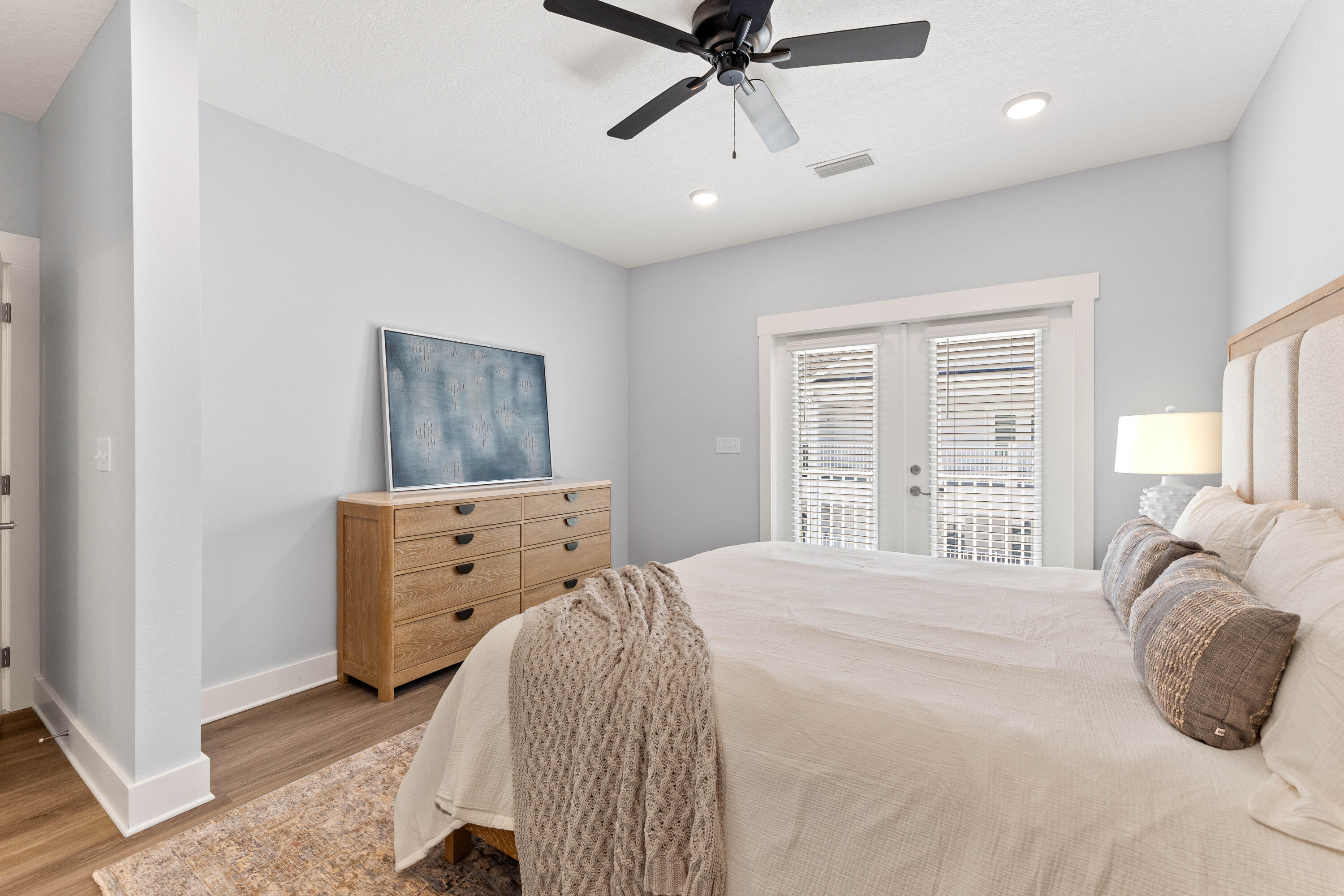 100 Beach Drive, Unit 7 Destin, FL 32541 - Photo 23 of 33 a bedroom with a bed and a window