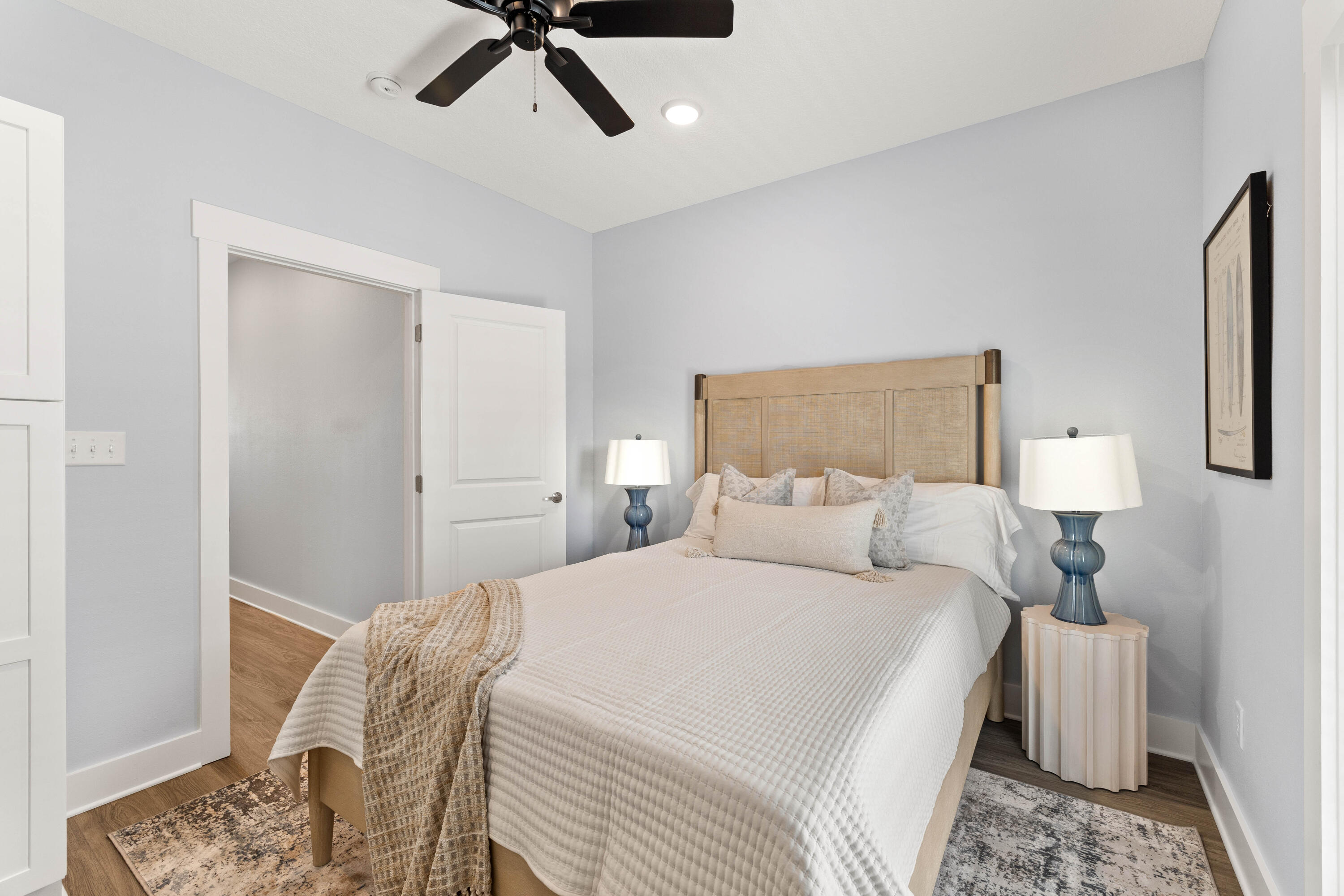 100 Beach Drive, Unit 7 Destin, FL 32541 - Photo 27 of 33 a bedroom with a bed and painting on the wall