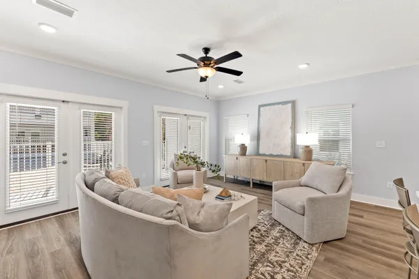 a living room with furniture and a large window