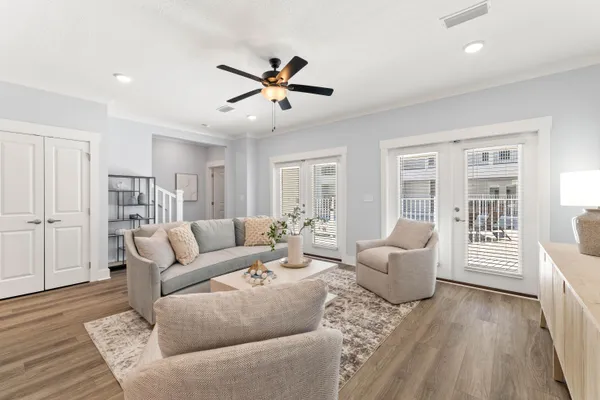 a living room with furniture and a large window