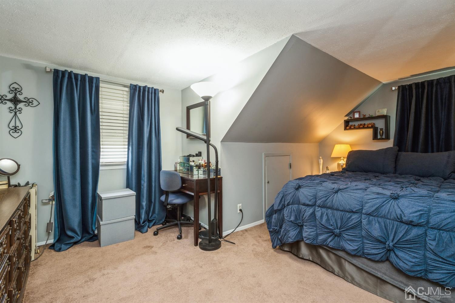 128 Old Post Road Edison, NJ 08817 - Photo 13 of 24 a bedroom with a bed and a cabinets