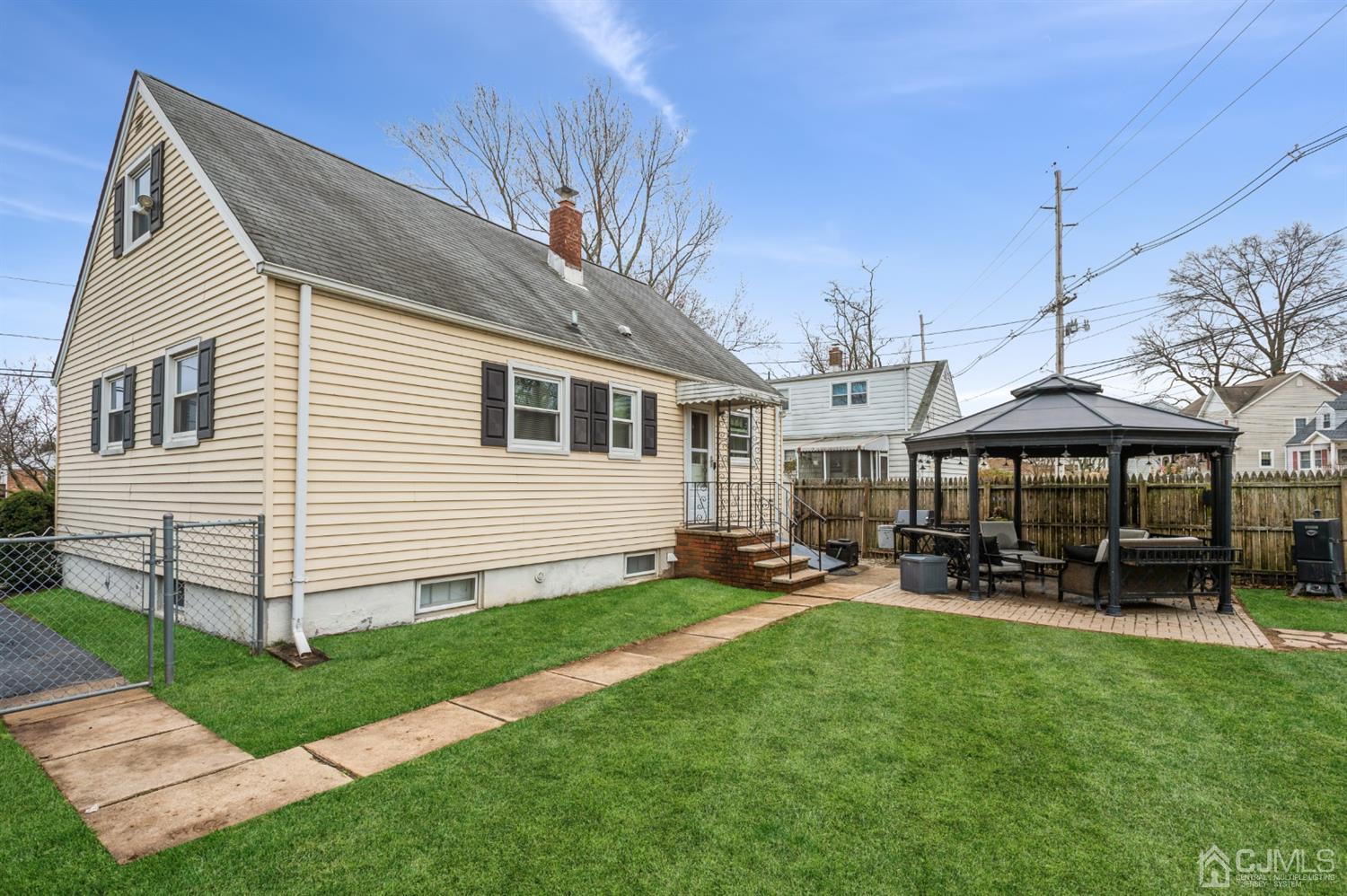 128 Old Post Road Edison, NJ 08817 - Photo 18 of 24 a view of a house with a yard and sitting area