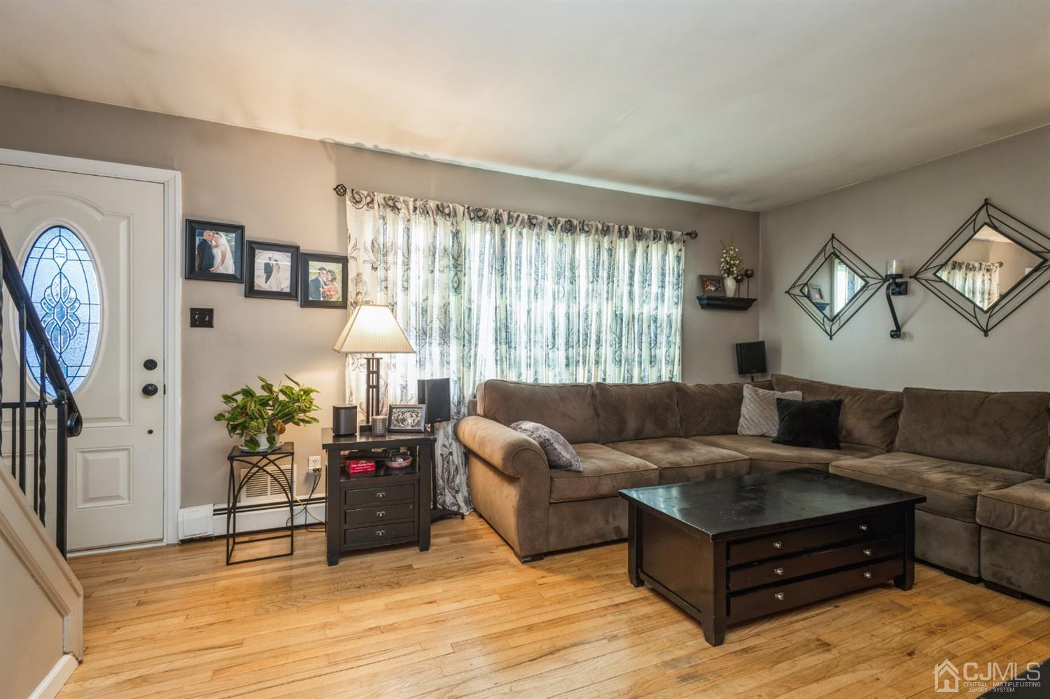 128 Old Post Road Edison, NJ 08817 - Photo 4 of 24 a living room with furniture and a large window