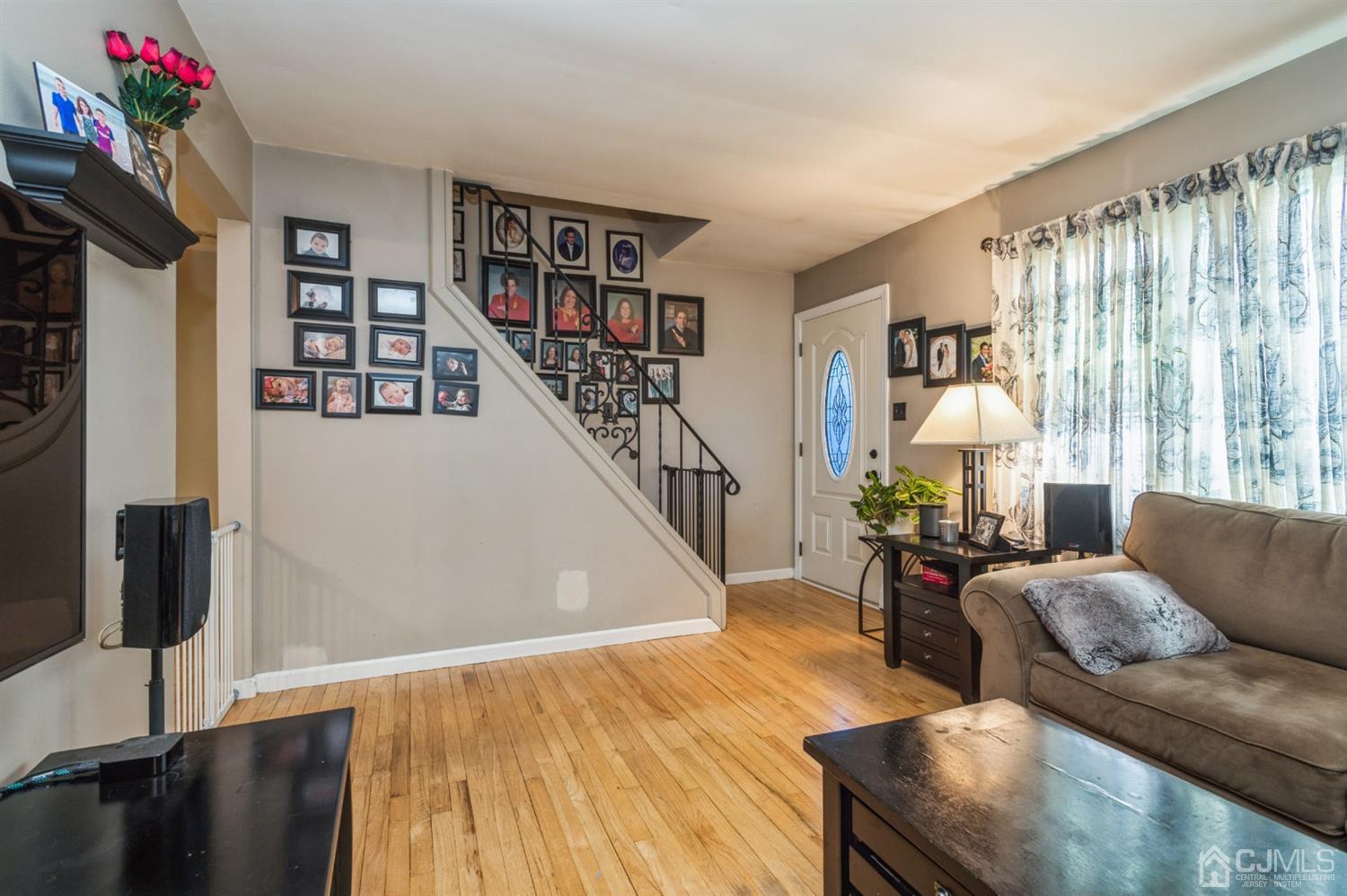 128 Old Post Road Edison, NJ 08817 - Photo 5 of 24 a living room with furniture and a book shelf
