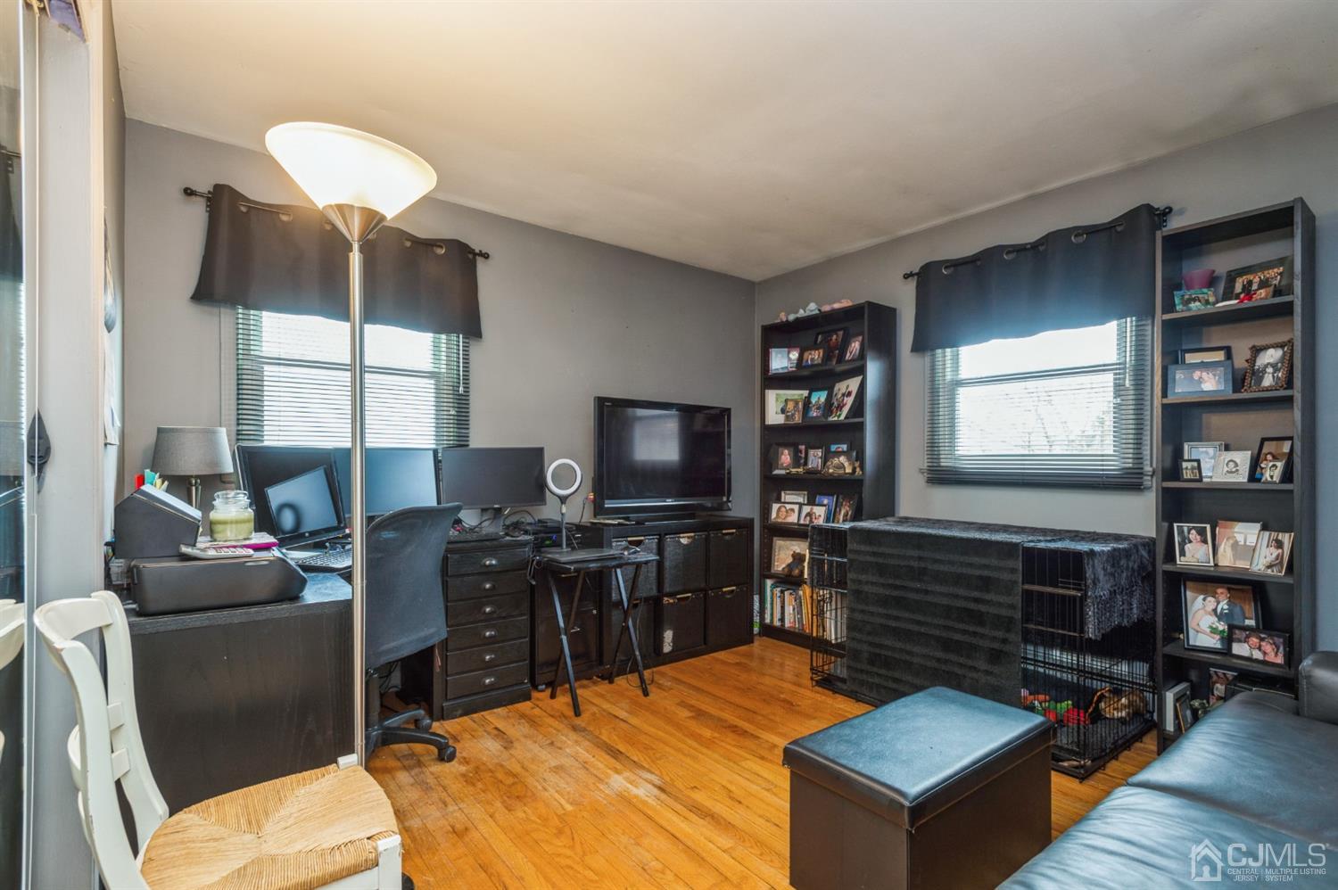 128 Old Post Road Edison, NJ 08817 - Photo 10 of 24 a living room with fireplace furniture and a flat screen tv