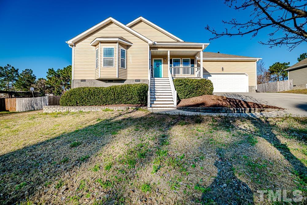 1652 Tingen Road Lillington, NC 27546 - Photo 1 of 30 a front view of a house with garden