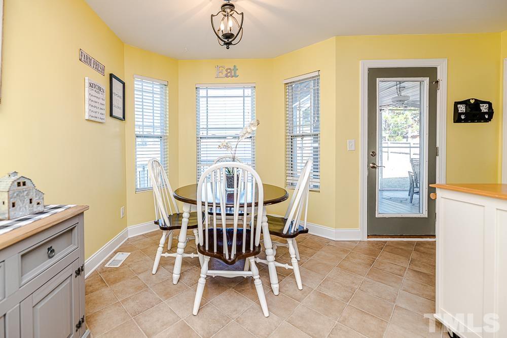 1652 Tingen Road Lillington, NC 27546 - Photo 11 of 30 a dining room with furniture and window