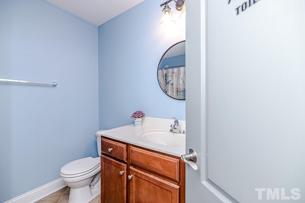 1652 Tingen Road Lillington, NC 27546 - Photo 13 of 30 a bathroom with a toilet and a sink