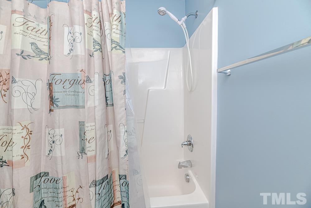 1652 Tingen Road Lillington, NC 27546 - Photo 14 of 30 a bathroom with a bathtub and shower