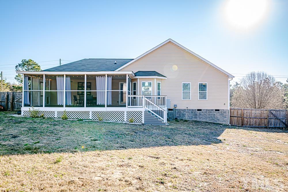 1652 Tingen Road Lillington, NC 27546 - Photo 28 of 30 a view of a house with a yard