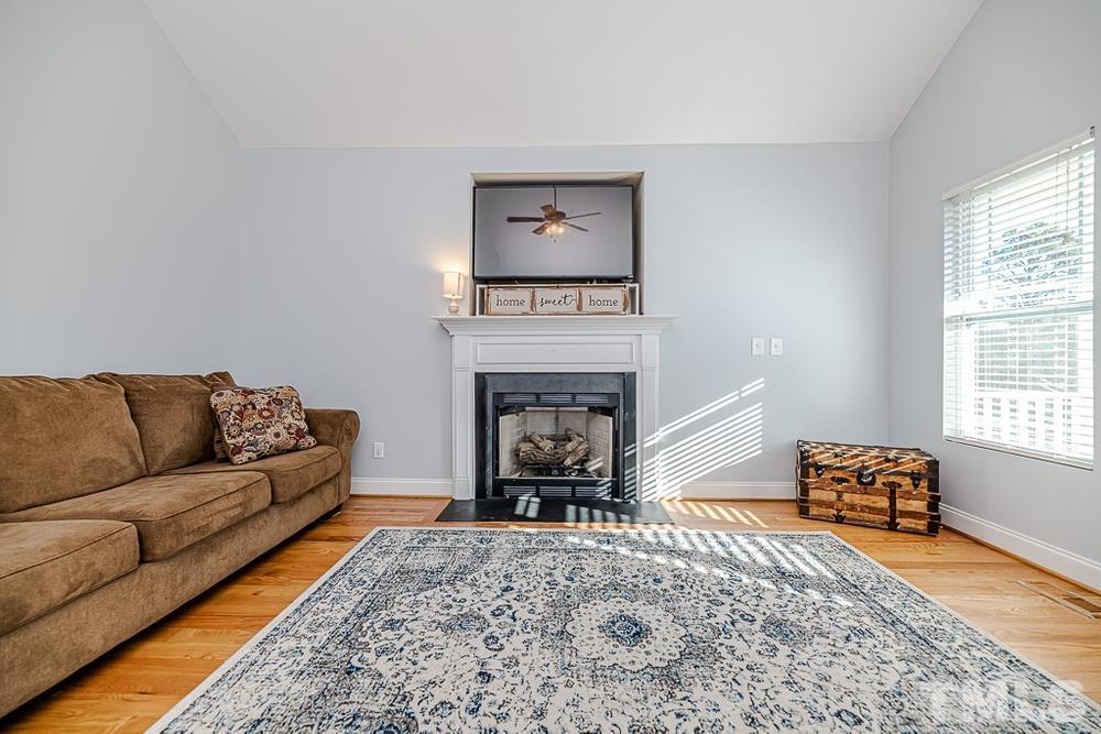 1652 Tingen Road Lillington, NC 27546 - Photo 5 of 30 a living room with furniture and a fireplace