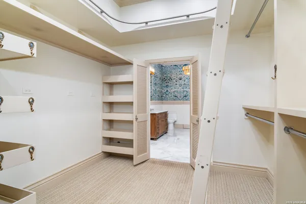 a view of an empty walk in closet