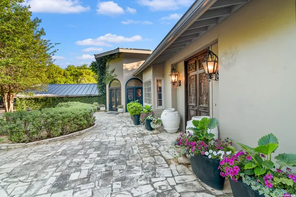 a front view of a house having a yard