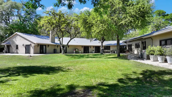 a front view of a house with a garden and porch
