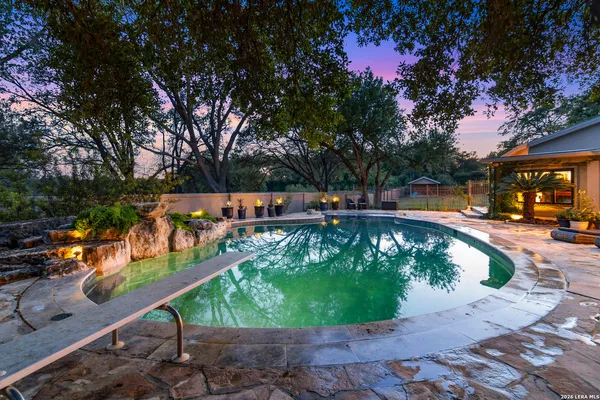 a view of a swimming pool with a patio