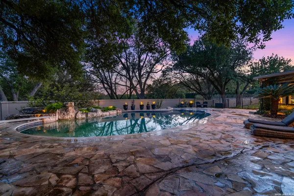 a view of backyard with sitting area