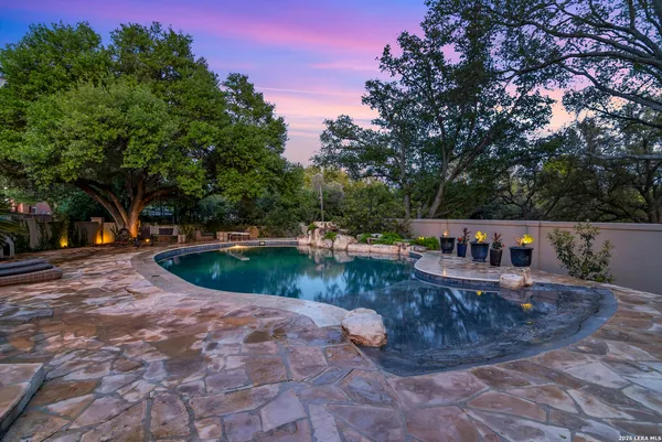 a view of a swimming pool with a patio