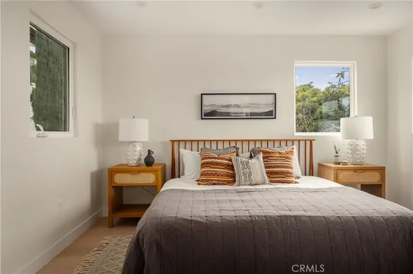a bedroom with bed and window