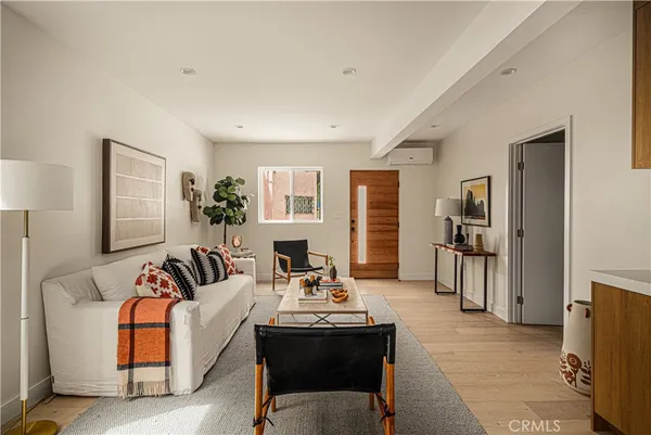 a living room with furniture and a table