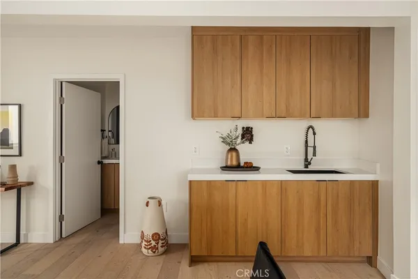a view of cabinets and wooden floor