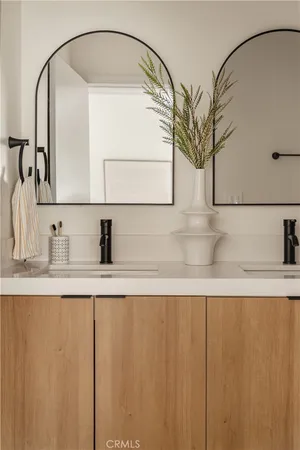 a bathroom with a sink and mirror