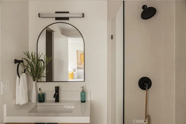 a bathroom with a sink and a mirror