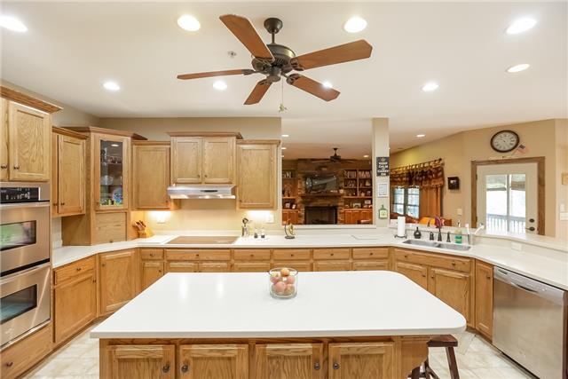 3955 Baxter Road Joelton, TN 37080 - Photo 8 of 20 Kitchen with Corian Counter, Stainless appliances and open to living room and breakfast room