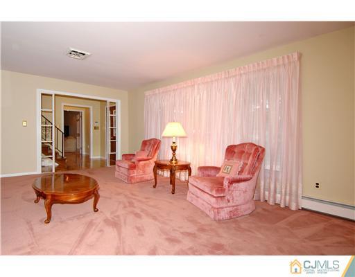 148 Broadway Road Cranbury, NJ 08512 - Photo 8 of 17 a living room with furniture a window and a potted plant