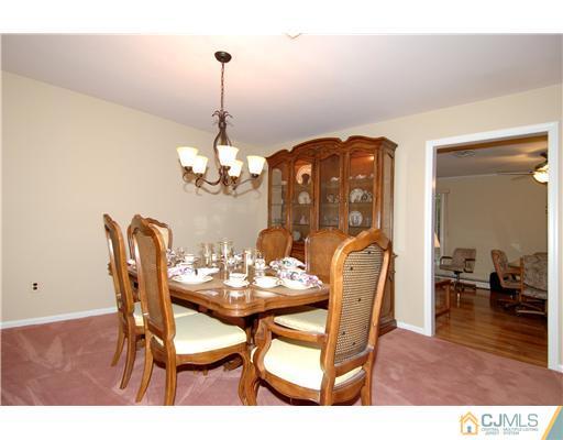 148 Broadway Road Cranbury, NJ 08512 - Photo 10 of 17 a dining room with furniture and wooden floor