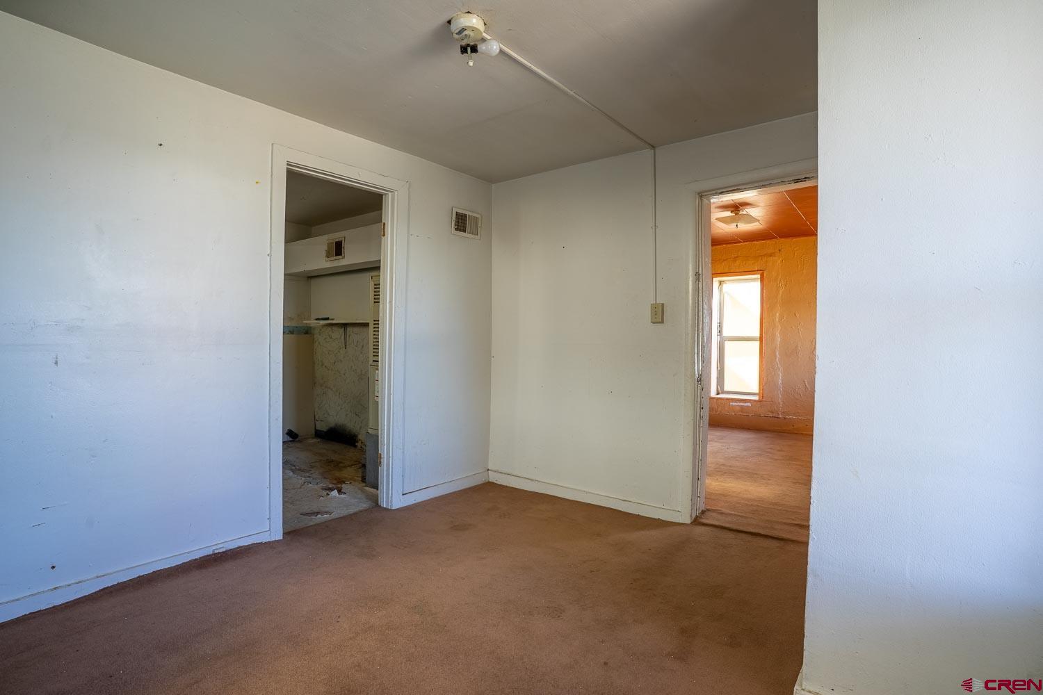 120 Browning Avenue Ignacio, CO 81137 - Photo 14 of 36 an empty room with windows and closet
