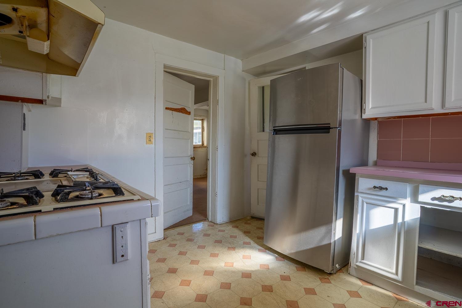 120 Browning Avenue Ignacio, CO 81137 - Photo 5 of 36 a kitchen with stainless steel appliances granite countertop a refrigerator and a stove