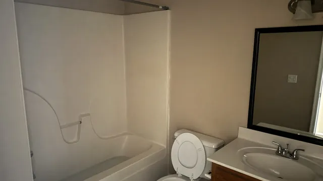 a bathroom with a toilet and a sink